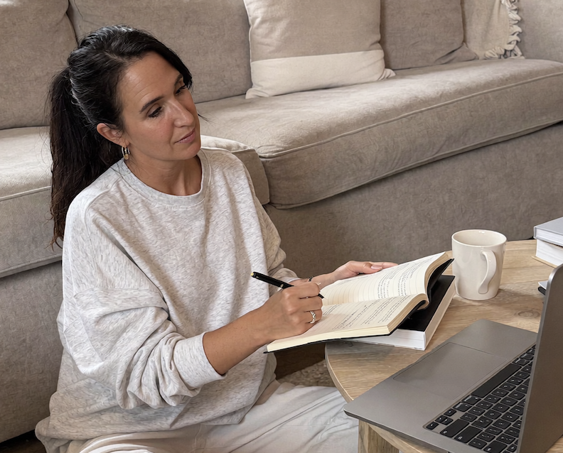 Anne preparing for The Marriage Shift, writing notes beside her laptop